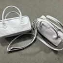 Lighter, softer and with easy handles and a crossbody strap.  Meet the all new MINI POSTCALL.