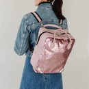 A bit smaller than the original backpack but still spacious enough for your laptop, jacket and travel mug. 