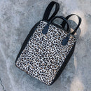 A bit smaller than the original backpack but still spacious enough for your laptop, jacket and travel mug. 