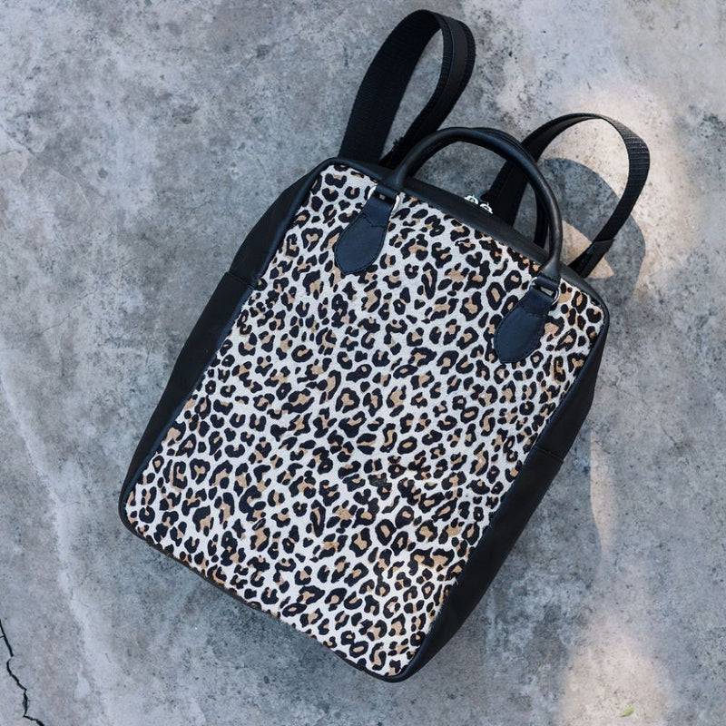 A bit smaller than the original backpack but still spacious enough for your laptop, jacket and travel mug. 