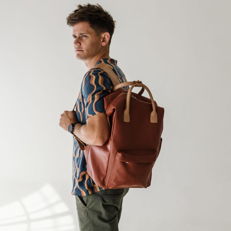 My Backpack can fit everything including the kitchen sink! Made for the practical busy bee from leather locally sourced.