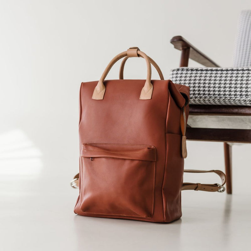 My Backpack can fit everything including the kitchen sink! Made for the practical busy bee from leather locally sourced.