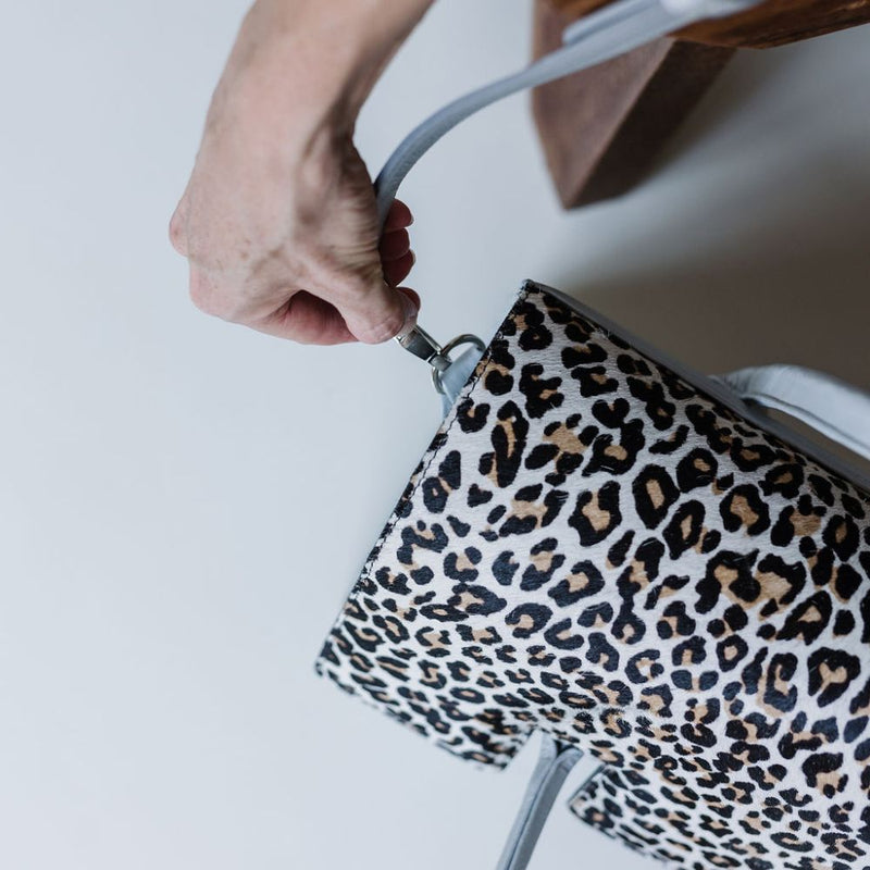 Introducing the&nbsp;Exotic Nguni Bossbag, a work bag designed for women by women. Crafted from&nbsp;rich brown leather&nbsp;and featuring an&nbsp;exotic Nguni hair-on leather finish&nbsp;with a stunning blue metallic element, this bag is both stylish and functional.