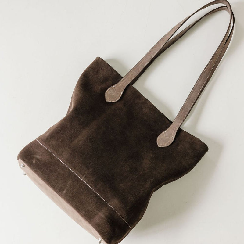 A throw-and-go bag. Not lined but with inside zip pocket.  Dimensions: 34 cm x 28 cm x 10 cm