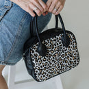 A limited-edition bag with only 10 pieces made. This exclusive design features exotic Nguni hair-on leather with delicate metallic gold splashes, beautifully complemented by a caramel leather back, bottom and sides.