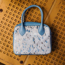 A limited-edition bag with only 10 pieces made. This exclusive design features exotic Nguni hair-on leather with delicate metallic gold splashes, beautifully complemented by a caramel leather back, bottom and sides.