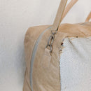 Dimensions: 52 cm x 30 cm x 25 cm. 100% cowhide with an inside lining and zip pocket.