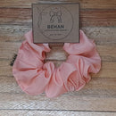 Handmade with care, our scrunchies offer a secure hold without pulling or tangling. Each measures around 20mm high and 100mm wide, with slight variations due to our unique, no-waste fabrics.
Soft elastic inside ensures comfort whether worn in your hair or on your wrist. Sustainable, stylish, and one of a kind—just like you