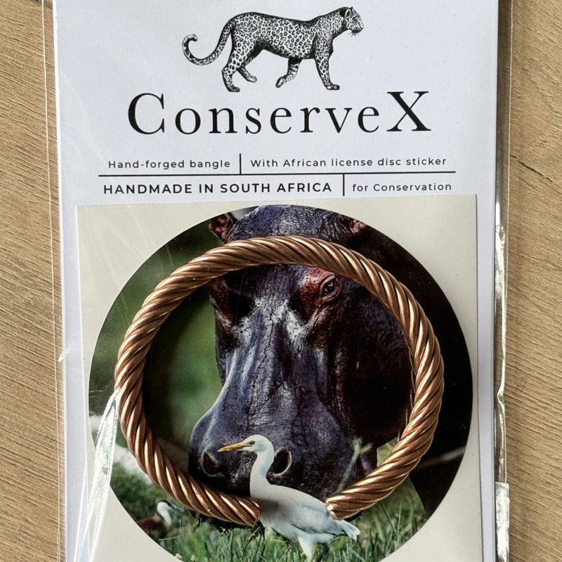 This hand-forged copper bangle, made by ConserveX, is a beautiful symbol of resilience and hope for African wildlife. 