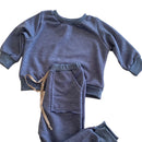 Stay Comfortable and warm in the square pocket tracksuit. These pants are not only for lounging around, but they are also perfect for outdoor activities on those cooler days. Elastic waist, string detail and front pockets.