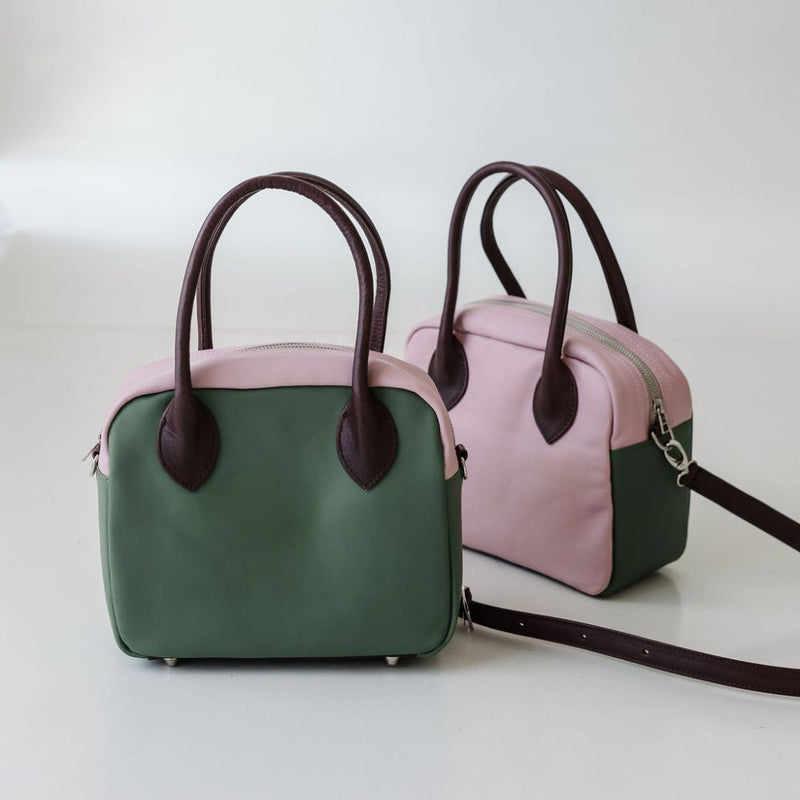 Updated handles, a refreshed crossbody strap with custom lining, printed in South Africa. 