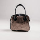 A limited-edition bag with only 10 pieces made. This exclusive design features exotic Nguni hair-on leather with delicate metallic gold splashes, beautifully complemented by a caramel leather back, bottom and sides.