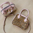 A limited-edition bag with only 10 pieces made. This exclusive design features exotic Nguni hair-on leather with delicate metallic gold splashes, beautifully complemented by a caramel leather back, bottom and sides.