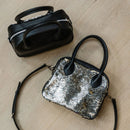 A limited-edition bag with only 10 pieces made. This exclusive design features exotic Nguni hair-on leather with delicate metallic gold splashes, beautifully complemented by a caramel leather back, bottom and sides.