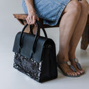 Introducing the Exotic Bossbag, a work bag designed for women by women. Crafted from rich black leather and featuring an Bling leather. This bag is both stylish and functional.