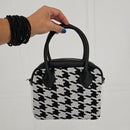 Updated handles, a refreshed crossbody strap with custom lining, printed in South Africa. 