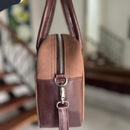 Updated handles, a refreshed crossbody strap with custom lining, printed in South Africa. 