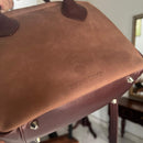 Updated handles, a refreshed crossbody strap with custom lining, printed in South Africa. 