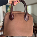 Updated handles, a refreshed crossbody strap with custom lining, printed in South Africa. 