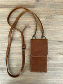 Contemporary sleek style. Affordable and accessible.

18.5cm x 10cm – fits new iPhone 15 pro max comfortably
Made from genuine full grain bovine leather
YKK metal zip on back for cash and small essentials
Brass fittings
Detachable leather strap with new look buckle
Available in black, toffee & dark brown. Other leather color options available on request.