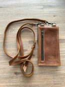 Contemporary sleek style. Affordable and accessible.

18.5cm x 10cm – fits new iPhone 15 pro max comfortably
Made from genuine full grain bovine leather
YKK metal zip on back for cash and small essentials
Brass fittings
Detachable leather strap with new look buckle
Available in black, toffee & dark brown. Other leather color options available on request.